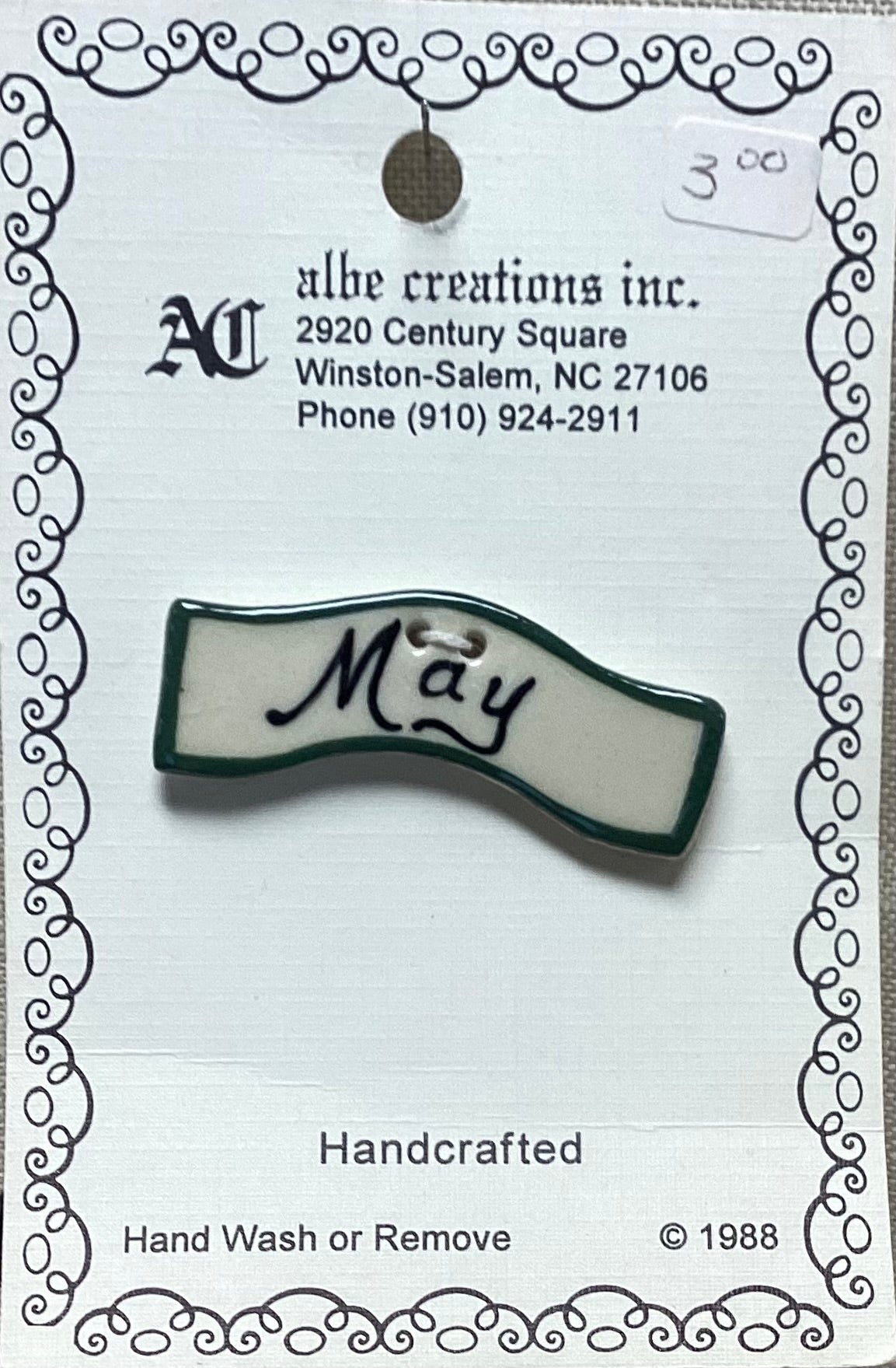 May Button by Albe Creations Inc.