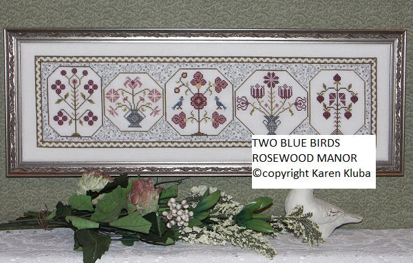 Two Blue Birds by Rosewood Manor